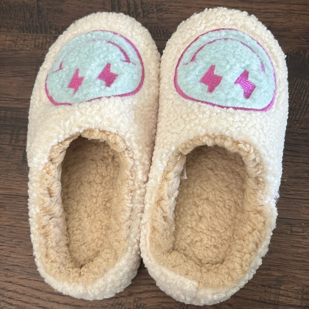 Women’s smiley face slippers.